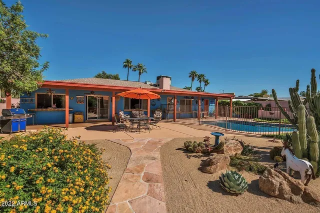 a front view of a house with swimming pool