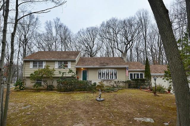 503 Rock Ridge Road Fairfield, CT 06824 - Photo 1 of 1 a front view of a house with garden