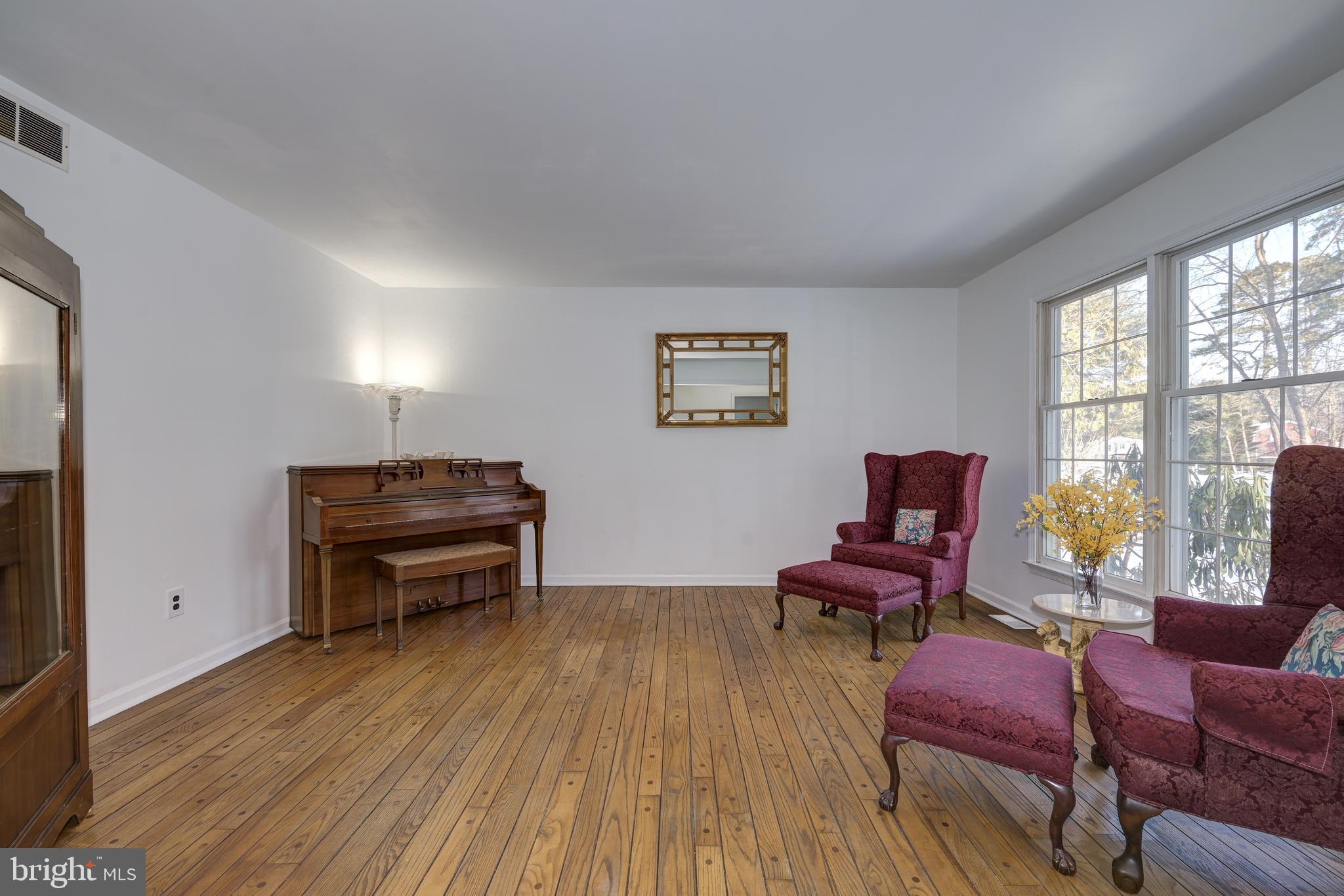 12 Friar Tuck Drive Medford, NJ 08055 - Photo 12 of 68 a room with furniture a piano and wooden floor