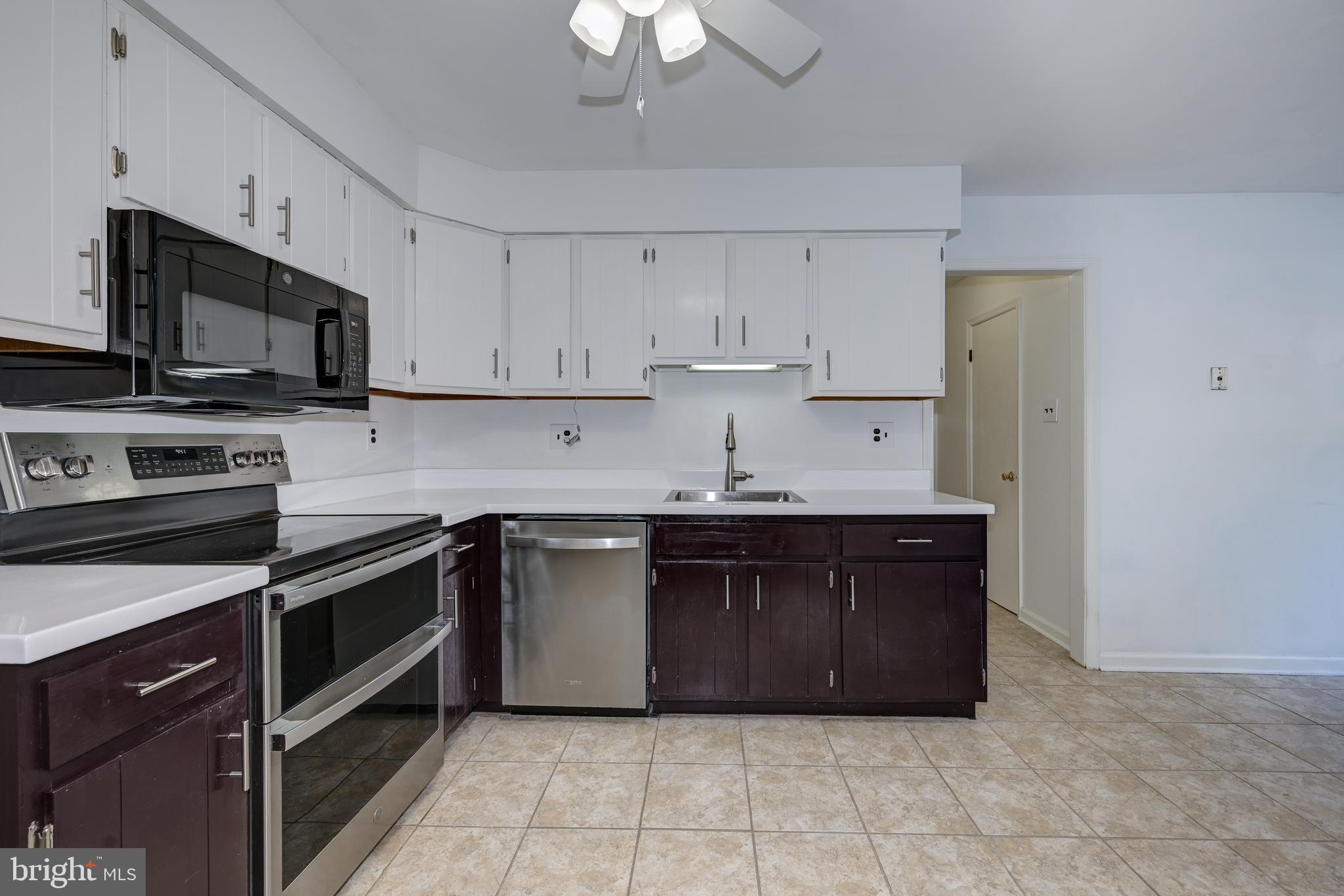 12 Friar Tuck Drive Medford, NJ 08055 - Photo 19 of 68 a kitchen with stainless steel appliances granite countertop a sink and a stove