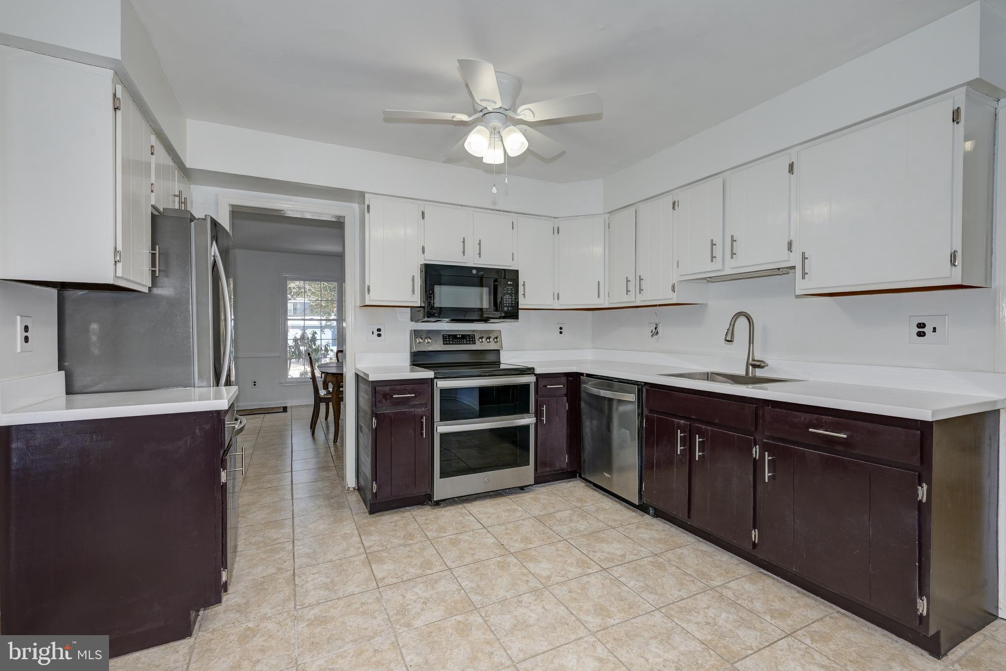 12 Friar Tuck Drive Medford, NJ 08055 - Photo 20 of 68 a kitchen with a sink cabinets and stainless steel appliances