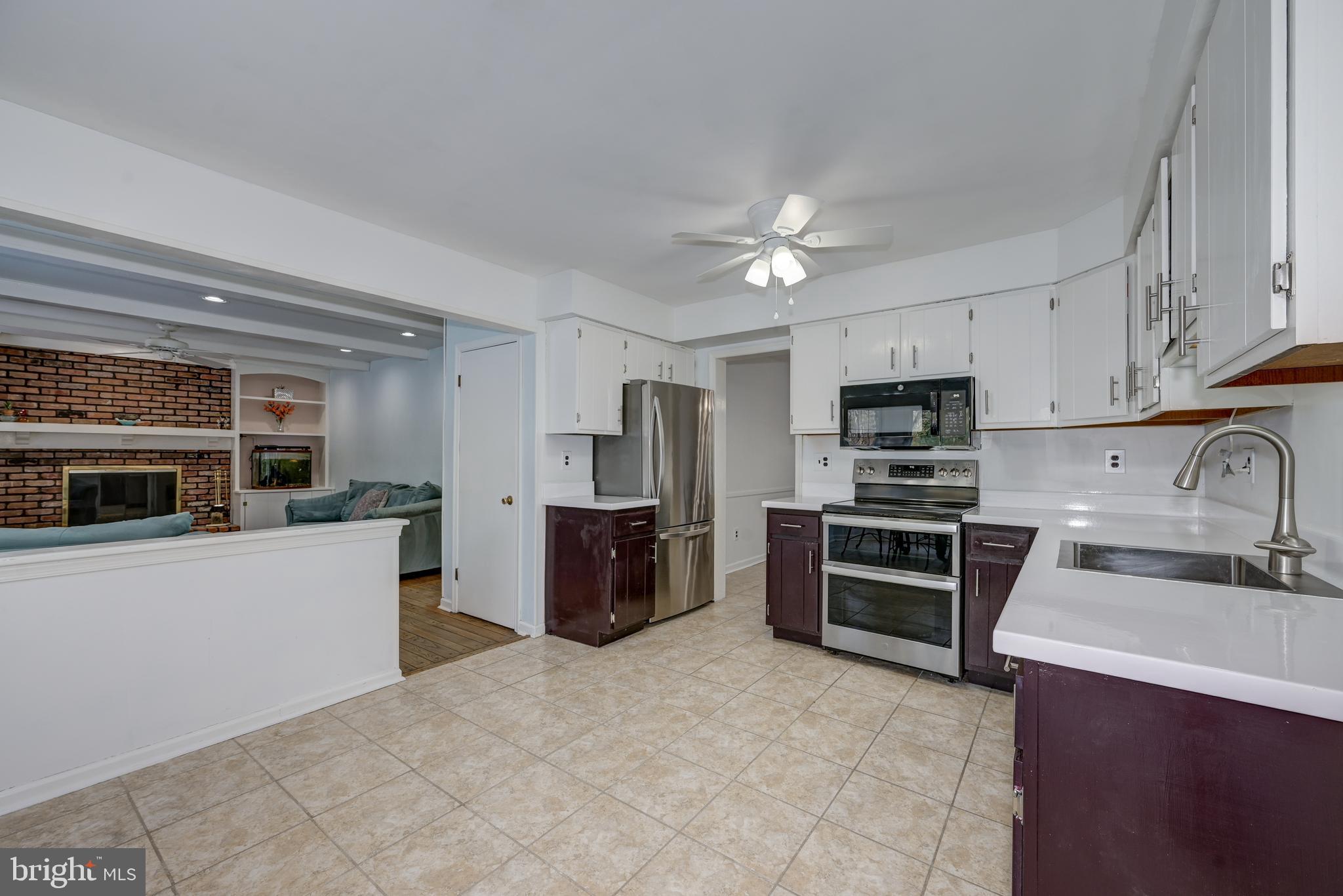 12 Friar Tuck Drive Medford, NJ 08055 - Photo 22 of 68 a kitchen with stainless steel appliances a stove refrigerator sink and microwave