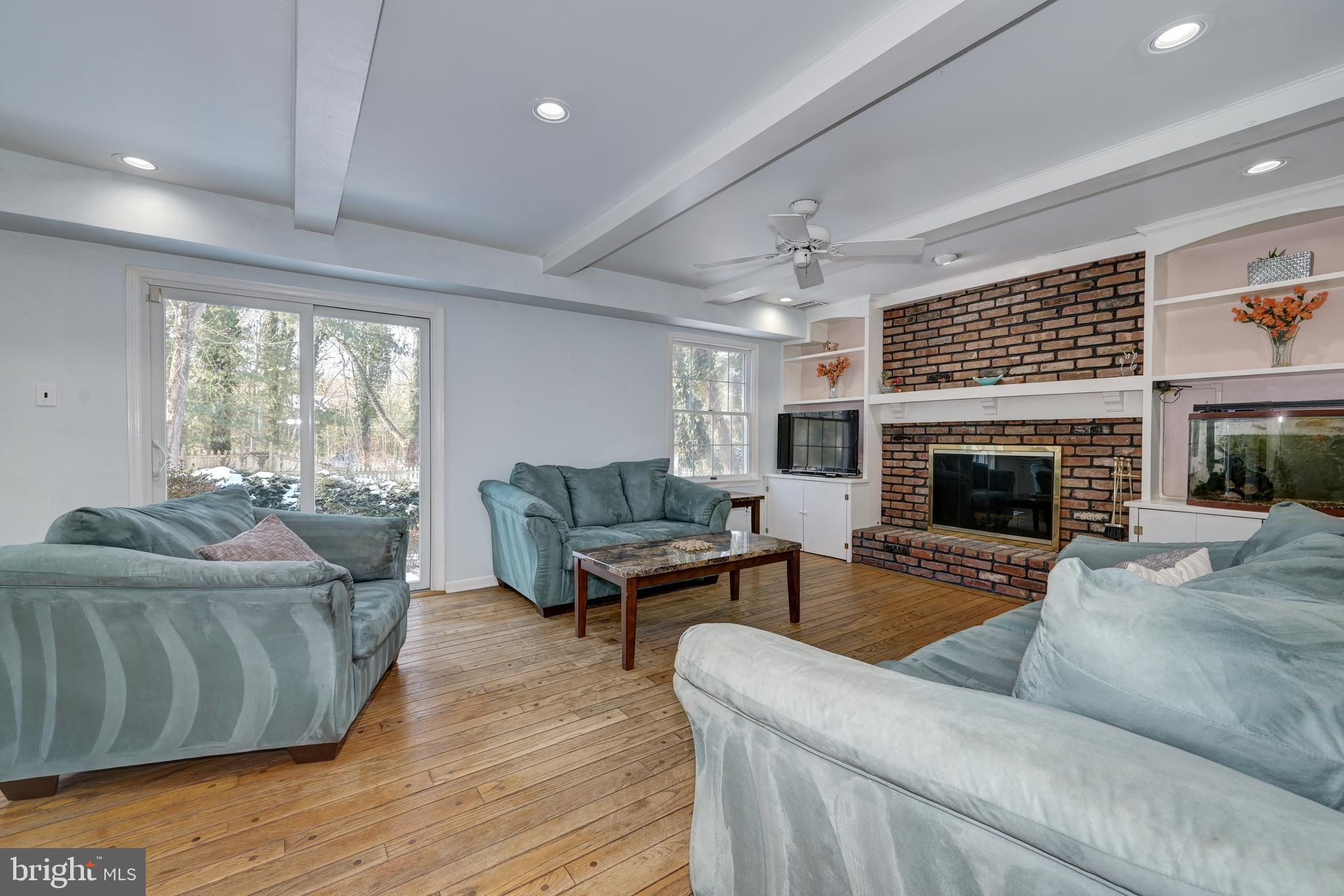 12 Friar Tuck Drive Medford, NJ 08055 - Photo 26 of 68 a living room with furniture and a fireplace