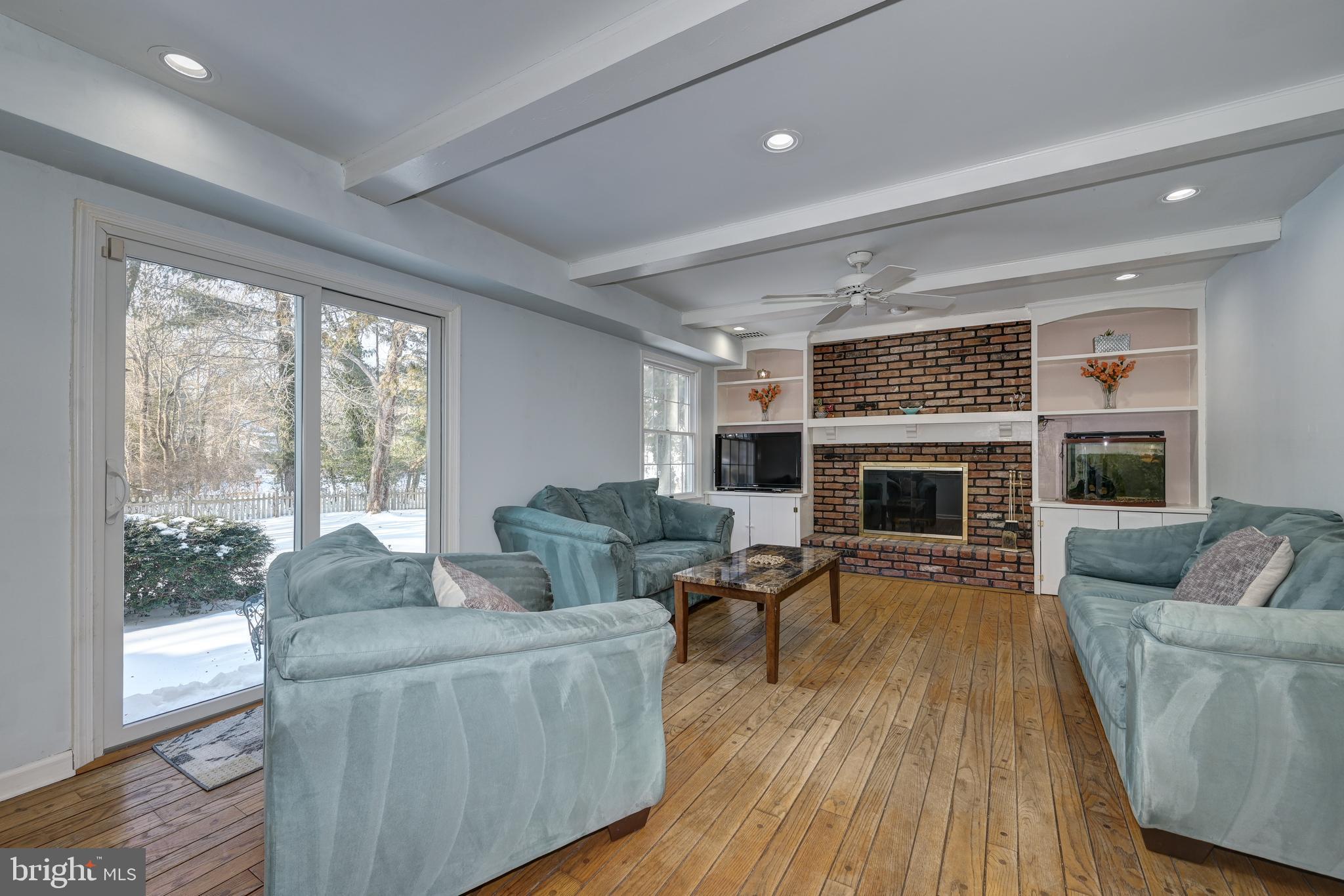 12 Friar Tuck Drive Medford, NJ 08055 - Photo 27 of 68 a living room with furniture and a fireplace