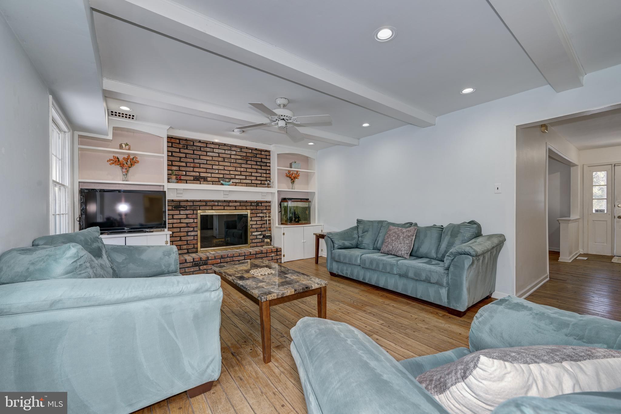 12 Friar Tuck Drive Medford, NJ 08055 - Photo 30 of 68 a living room with furniture and a fireplace