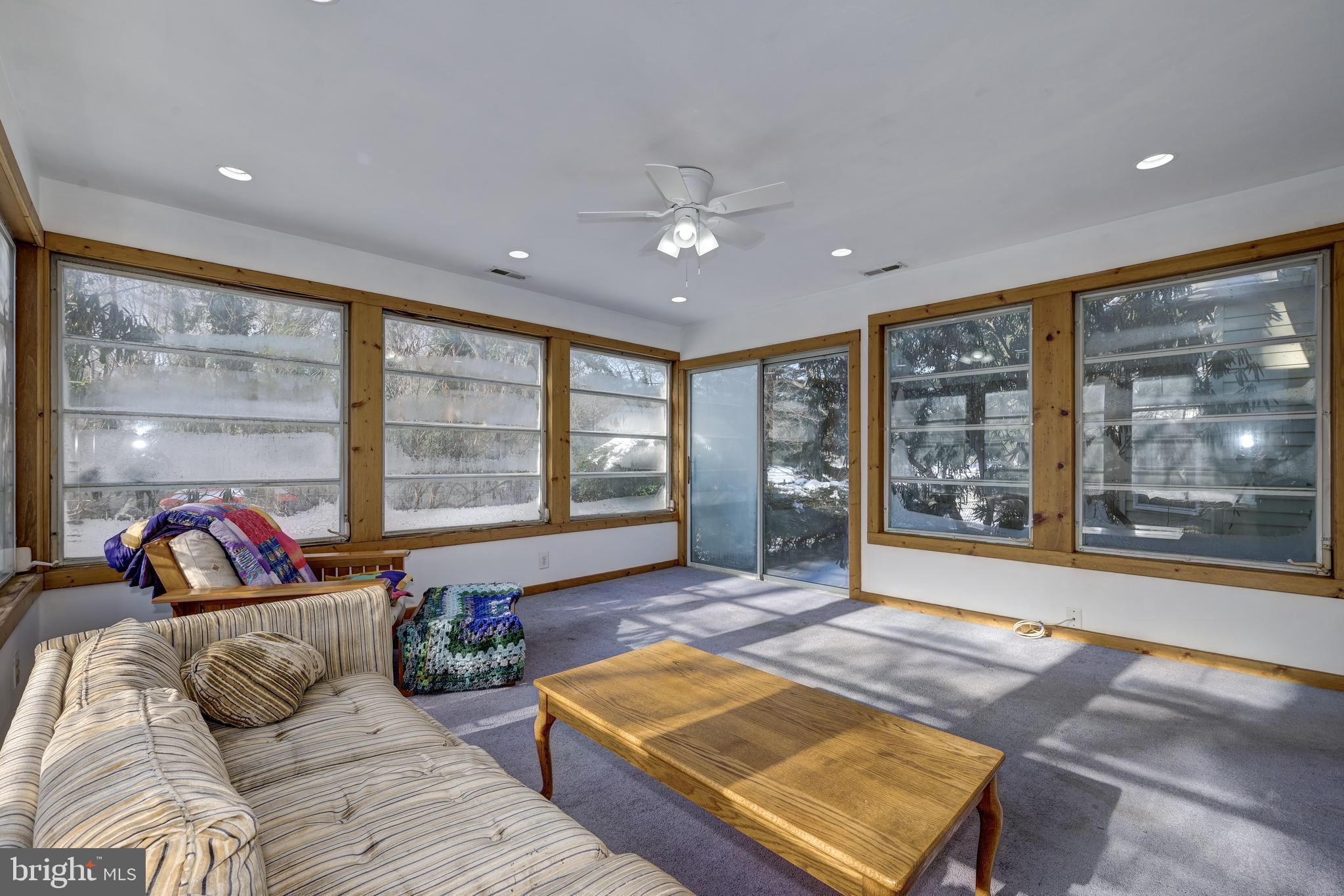 12 Friar Tuck Drive Medford, NJ 08055 - Photo 32 of 68 a living room with furniture and large windows