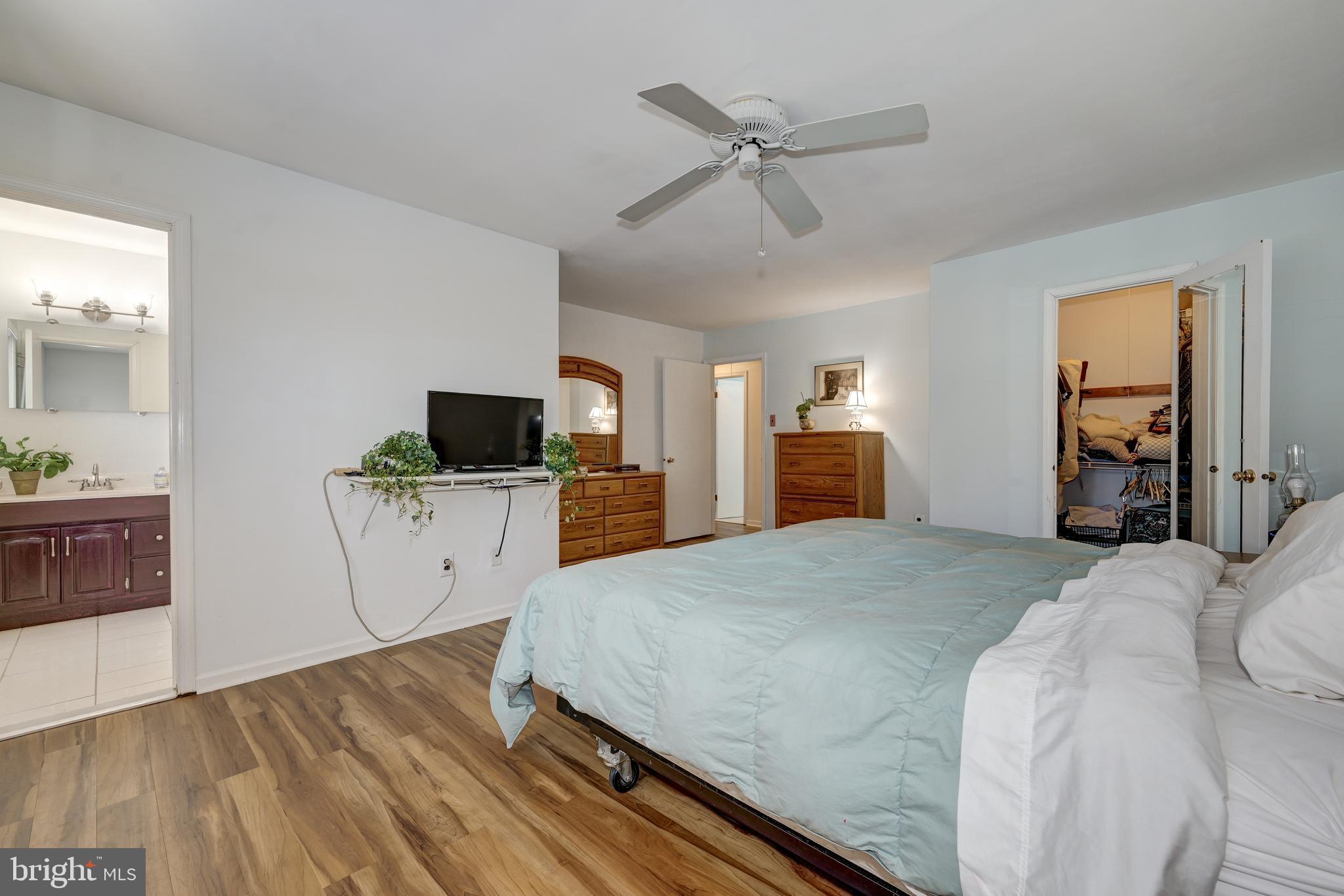 12 Friar Tuck Drive Medford, NJ 08055 - Photo 37 of 68 a bedroom with a bed and a flat screen tv