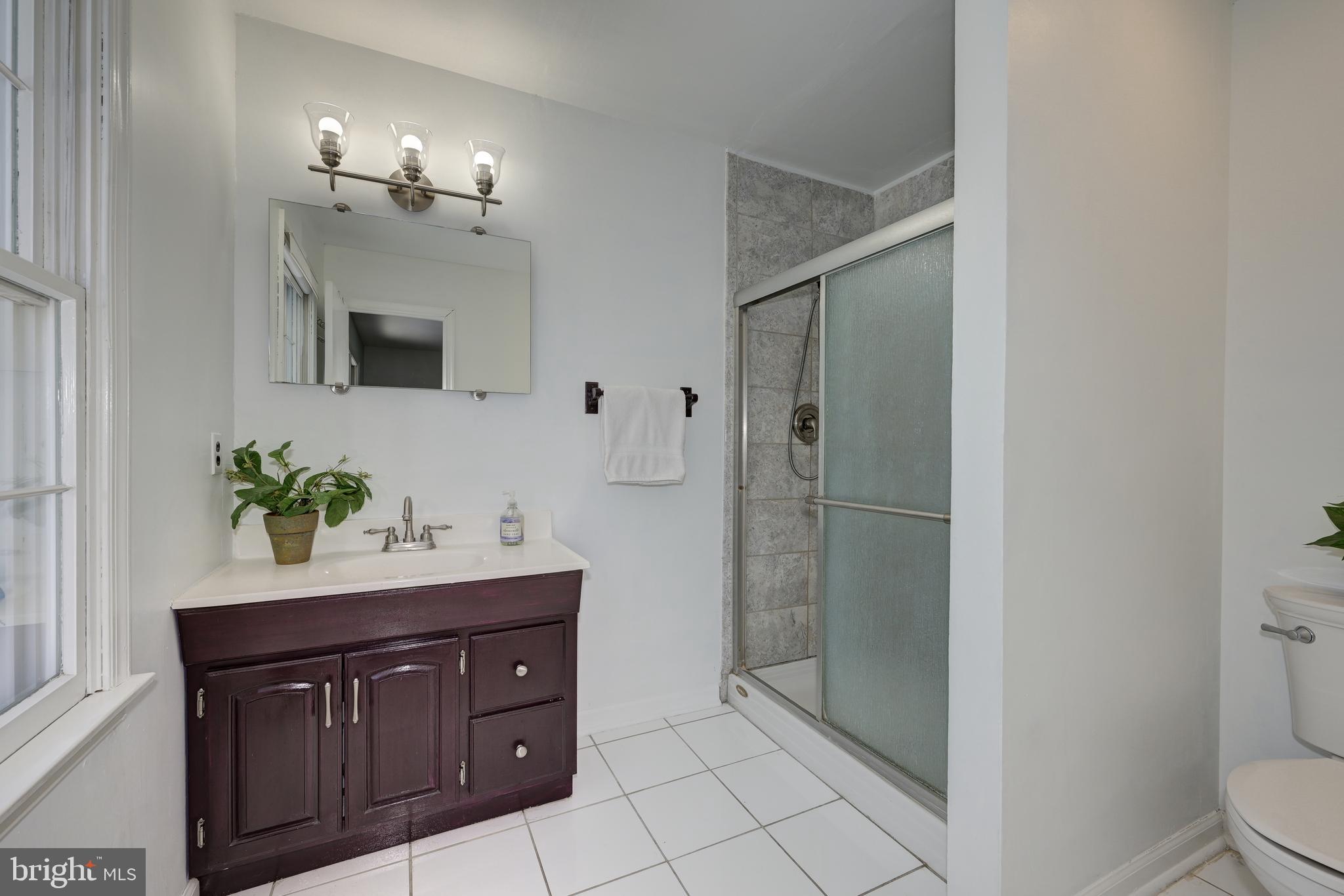 12 Friar Tuck Drive Medford, NJ 08055 - Photo 38 of 68 a bathroom with a sink a toilet and shower