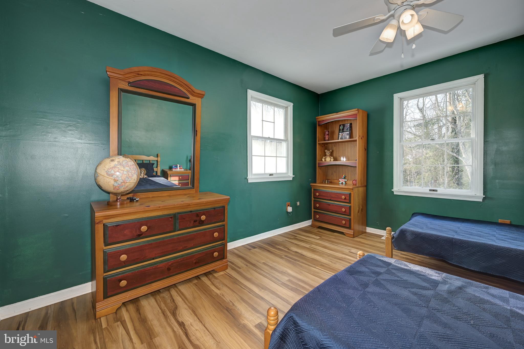 12 Friar Tuck Drive Medford, NJ 08055 - Photo 42 of 68 a bedroom with a bed and a dresser next to a window