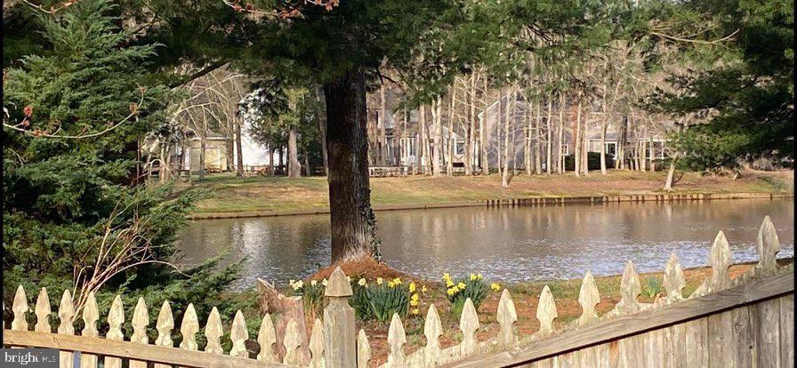 12 Friar Tuck Drive Medford, NJ 08055 - Photo 5 of 68 a view of a lake with a tree