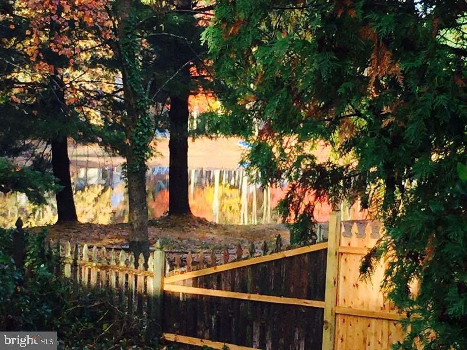 12 Friar Tuck Drive Medford, NJ 08055 - Photo 57 of 68 a view of a house with large tree next to a yard