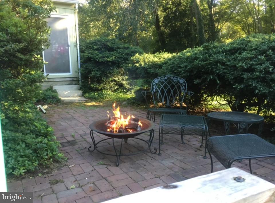 12 Friar Tuck Drive Medford, NJ 08055 - Photo 66 of 68 a outdoor space with the couches and a potted plant