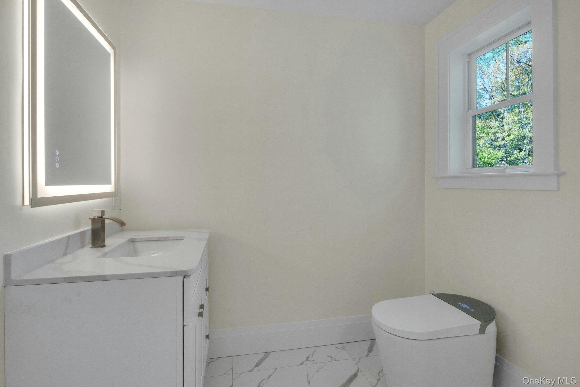 57 Meadow Sweet Road Cortlandt Manor, NY 10567 - Photo 30 of 49 Hall bath with porcelain tile, smart toilet and bathtub.