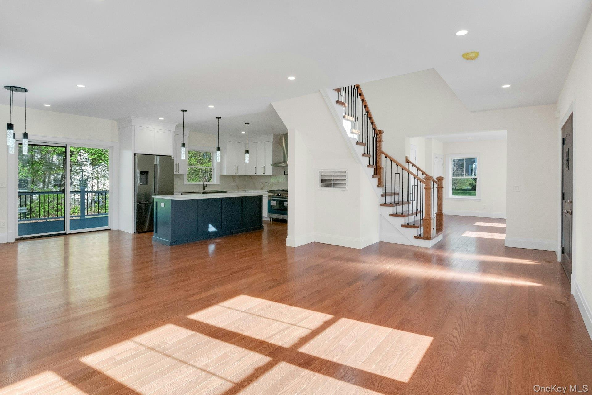 57 Meadow Sweet Road Cortlandt Manor, NY 10567 - Photo 4 of 49 View of living room looking into kitchen, den and stairs leading upstairs.