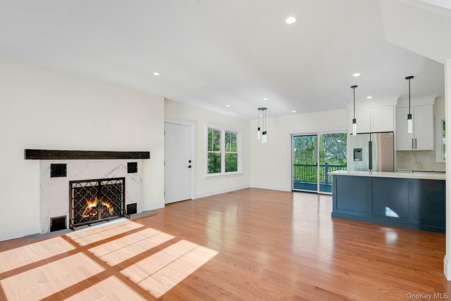 57 Meadow Sweet Road Cortlandt Manor, NY 10567 - Photo 6 of 49 View of fireplace kitchen & dining area.