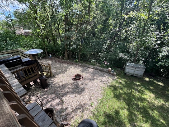 2795 East 28th Road Marseilles, IL 61341 - Photo 29 of 74 a view of a backyard with chairs and a fire pit