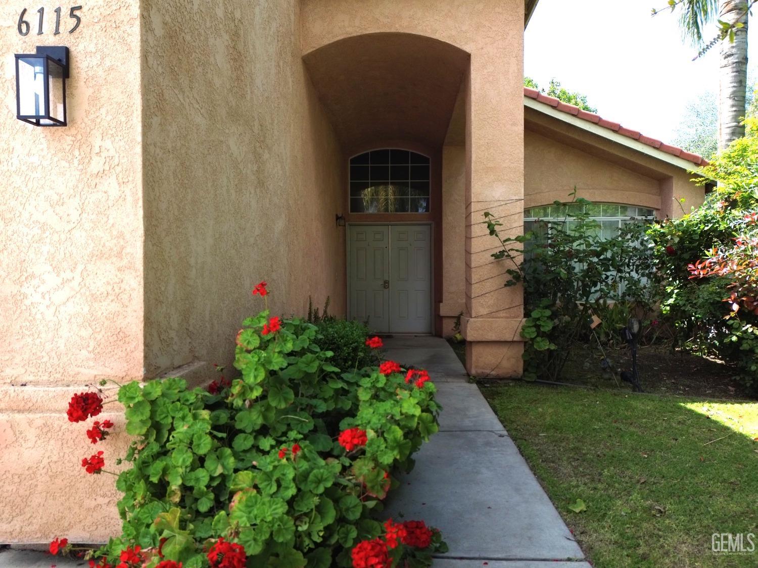 Undisclosed Address Bakersfield, CA 93313 - Photo 12 of 32 a flower plants in front of a door