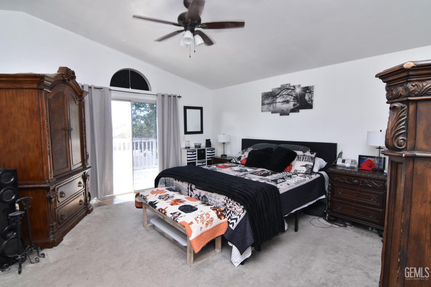 Undisclosed Address Bakersfield, CA 93313 - Photo 17 of 32 a bed room with furniture and a flat screen tv