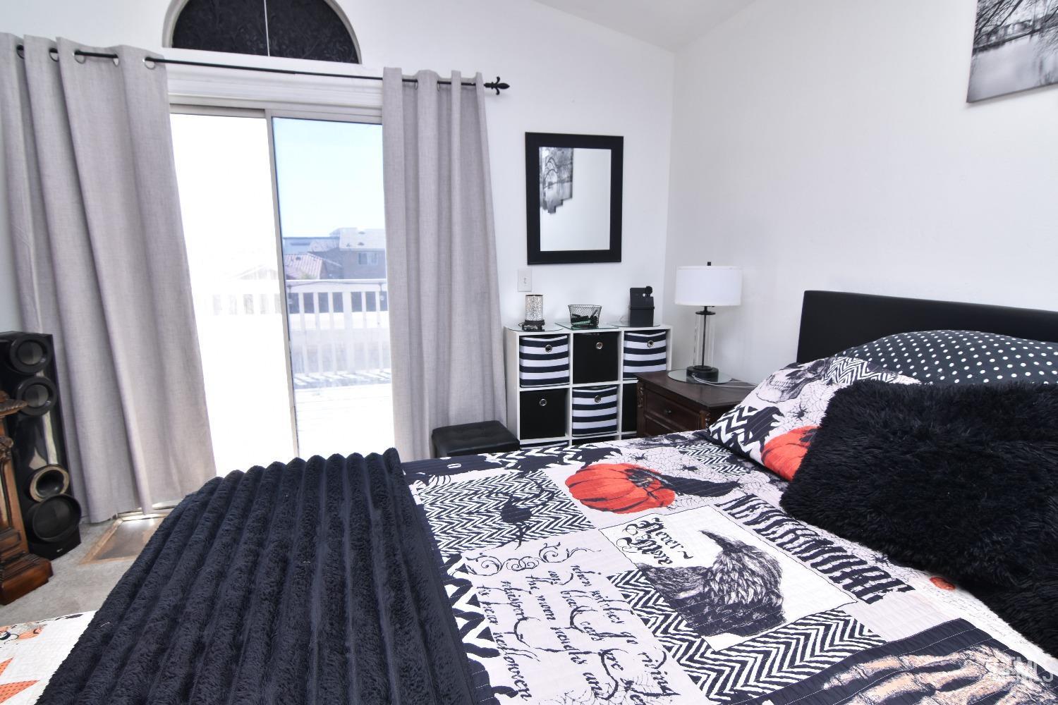 Undisclosed Address Bakersfield, CA 93313 - Photo 18 of 32 a bedroom with a bed and a window