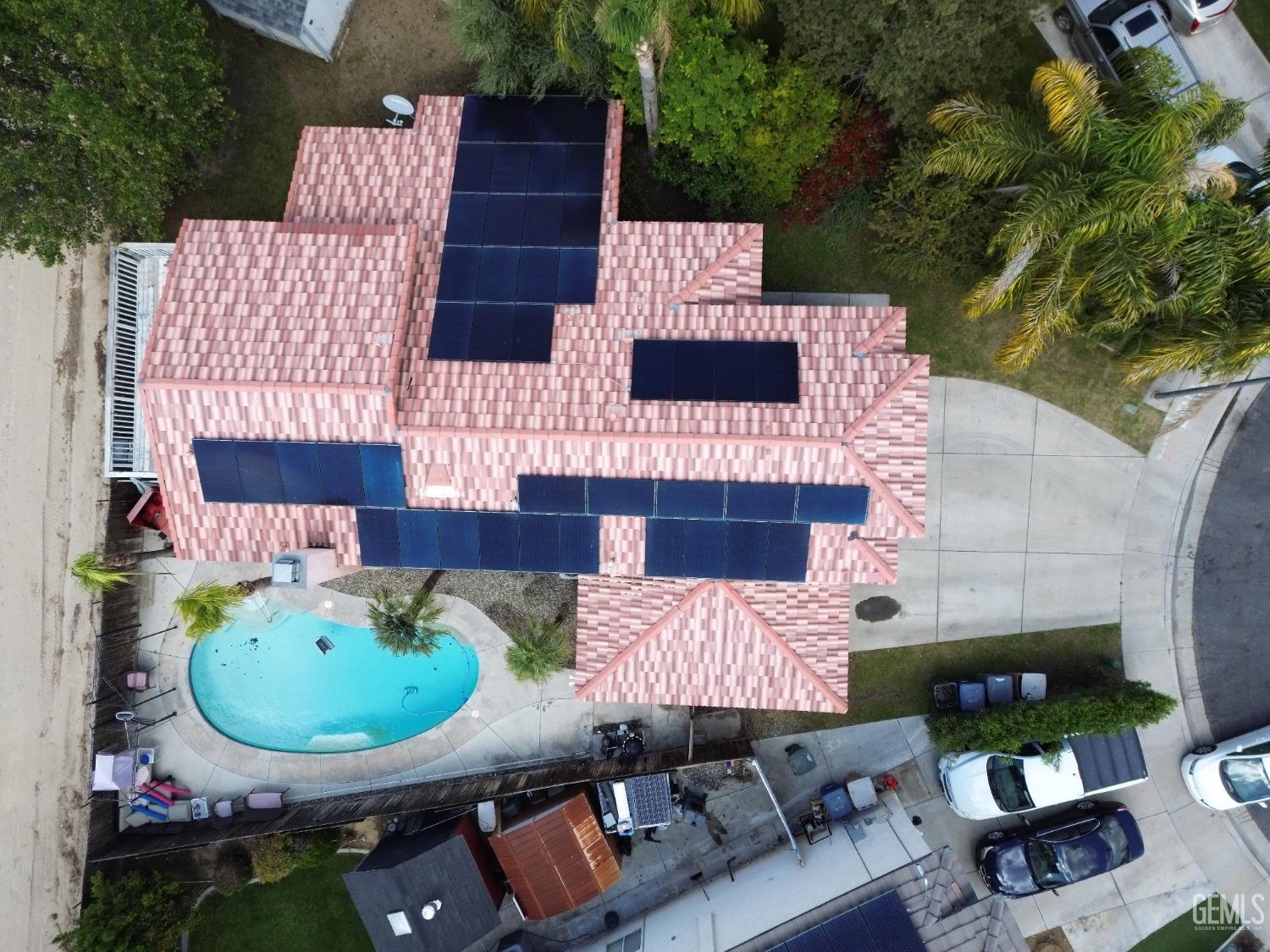 Undisclosed Address Bakersfield, CA 93313 - Photo 2 of 32 an aerial view of a house with backyard and outdoor seating