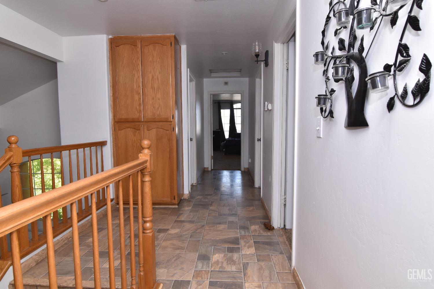Undisclosed Address Bakersfield, CA 93313 - Photo 21 of 32 a view of a hallway with wooden floor and entryway