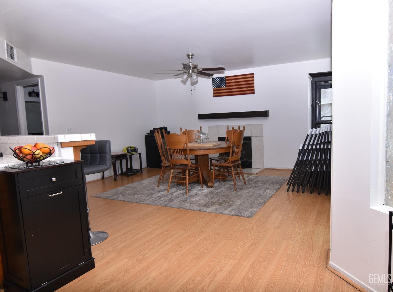 Undisclosed Address Bakersfield, CA 93313 - Photo 28 of 32 a dining room with furniture and wooden floor