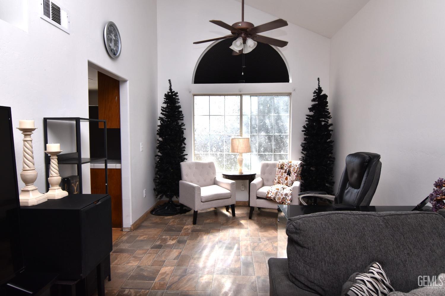 Undisclosed Address Bakersfield, CA 93313 - Photo 31 of 32 a living room with furniture and a window