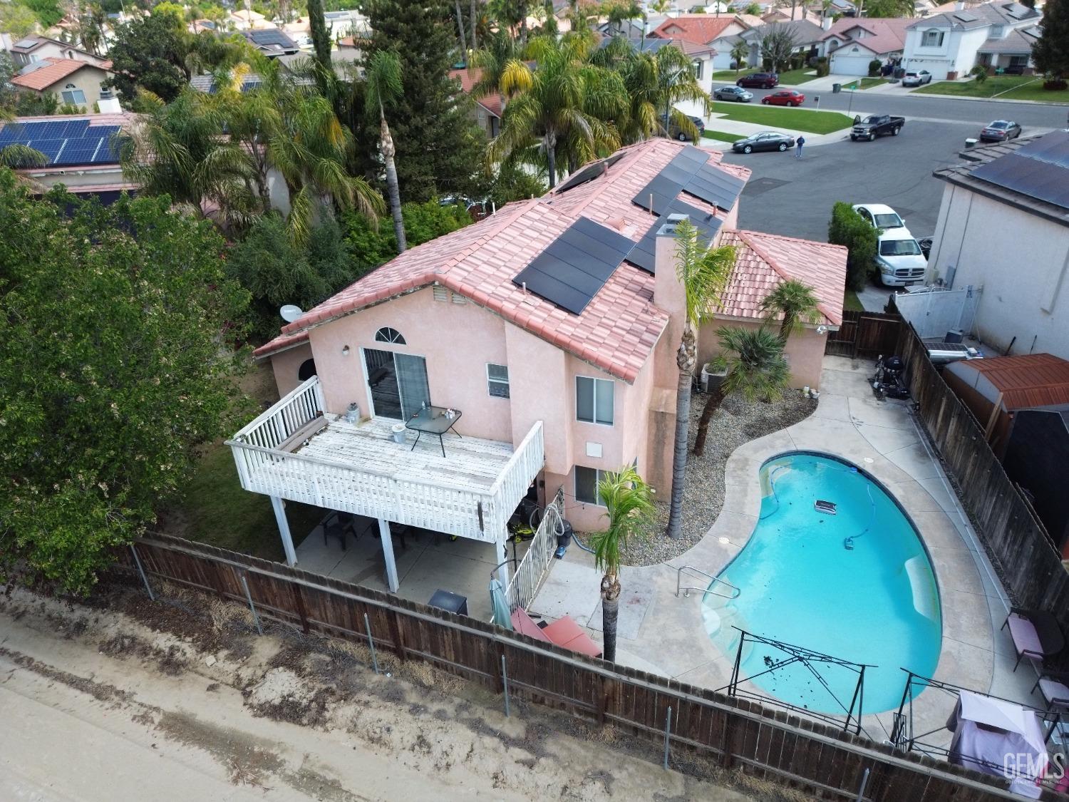 Undisclosed Address Bakersfield, CA 93313 - Photo 4 of 32 an aerial view of a house with garden space and sitting area