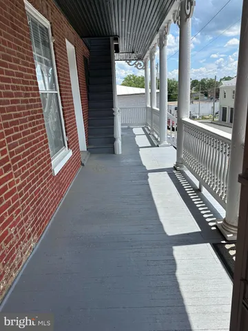 a view of a balcony with couch