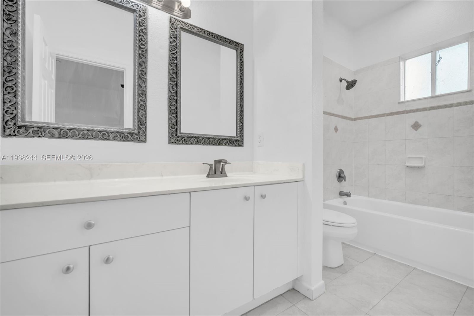400 Princess Drive Margate, FL 33068 - Photo 15 of 26 a bathroom with a bathtub shower sink and a toilet