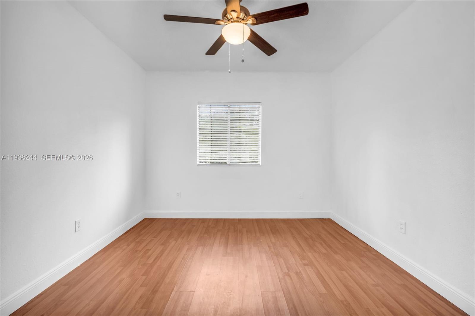 400 Princess Drive Margate, FL 33068 - Photo 16 of 26 a view of empty room with wooden floor and fan