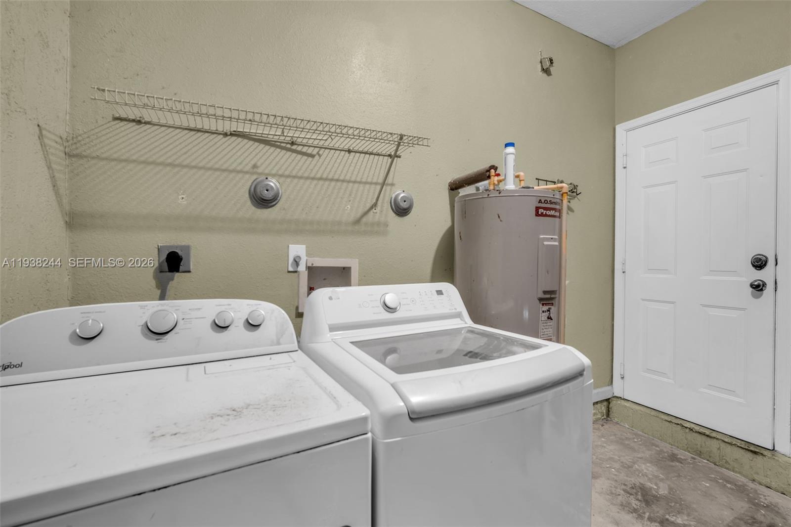 400 Princess Drive Margate, FL 33068 - Photo 25 of 26 a utility room with dryer and washer