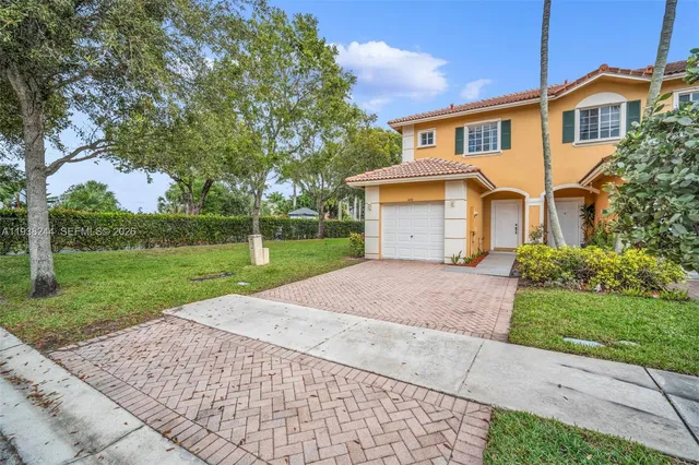 front view of a house with a yard