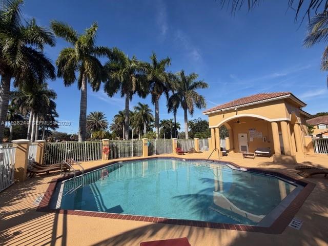 400 Princess Drive Margate, FL 33068 - Photo 3 of 26 a view of a swimming pool with a patio
