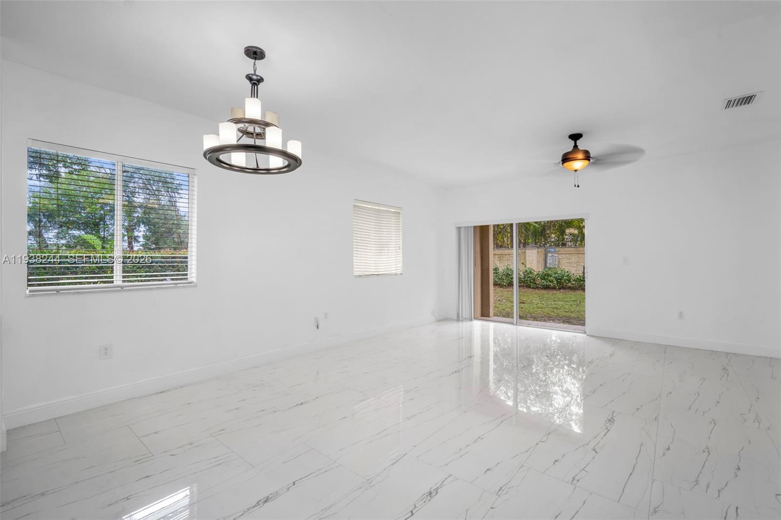 400 Princess Drive Margate, FL 33068 - Photo 8 of 26 a view of an empty room with a window