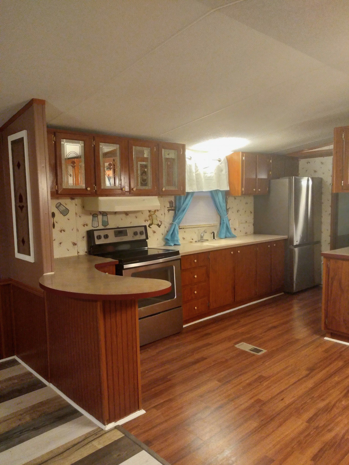 911 Ragsdale Lane Pulaski, TN 38478 - Photo 18 of 66 a kitchen view with wooden floor and cabinets