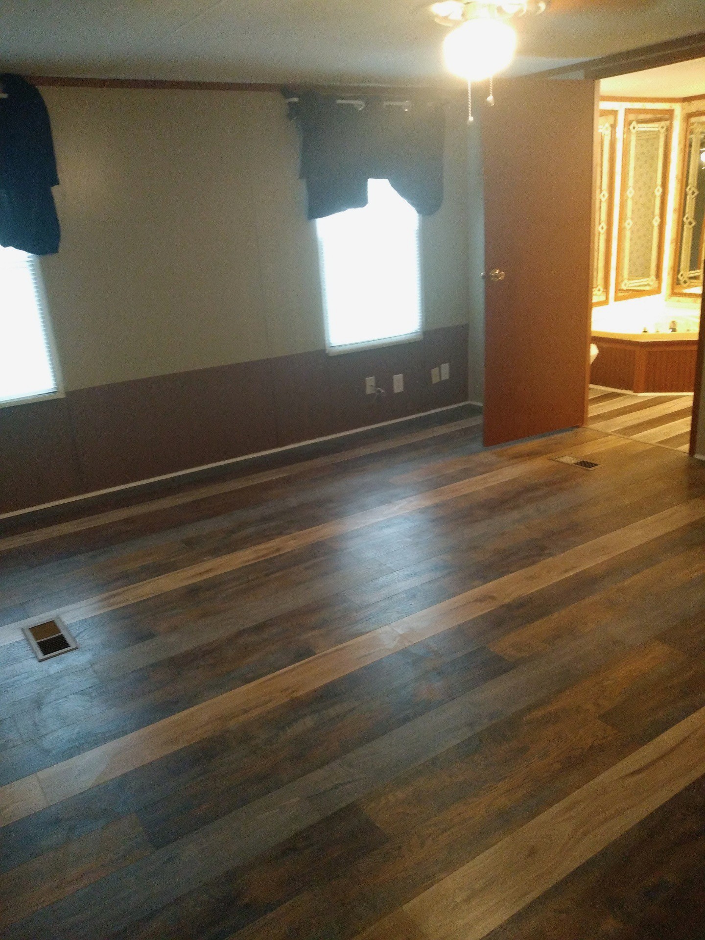 911 Ragsdale Lane Pulaski, TN 38478 - Photo 42 of 66 an empty room with wooden floor and windows