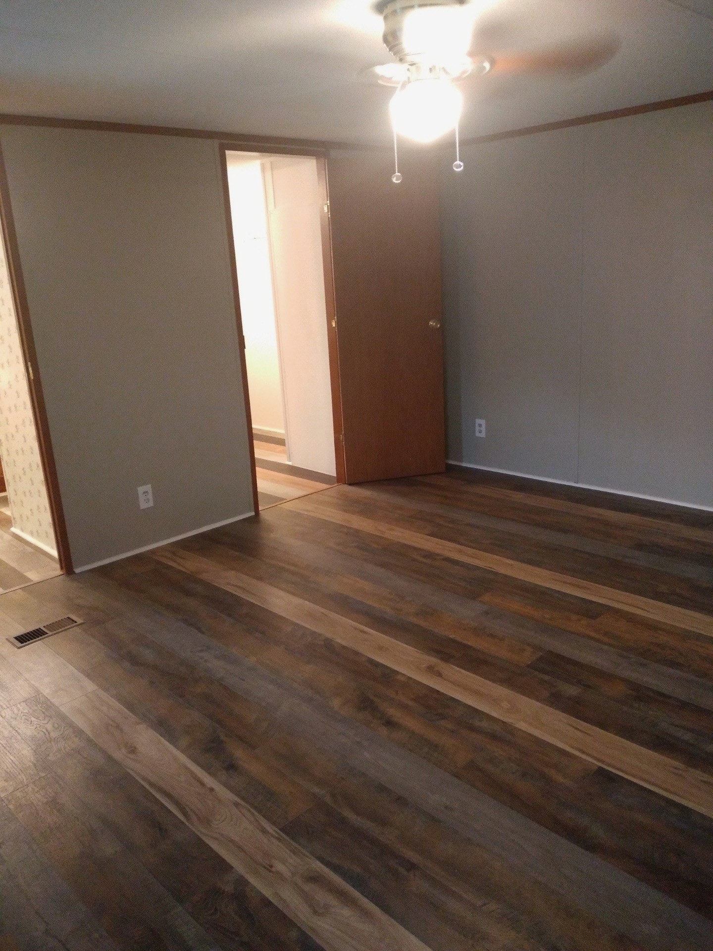 911 Ragsdale Lane Pulaski, TN 38478 - Photo 43 of 66 an empty room with wooden floor and windows