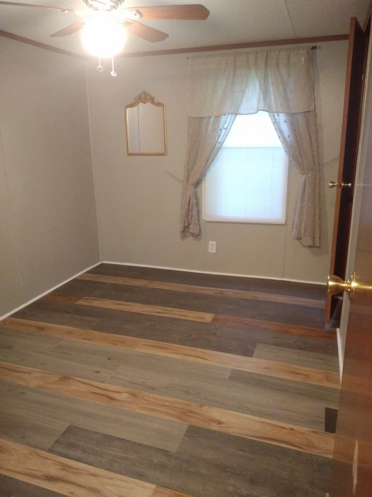 911 Ragsdale Lane Pulaski, TN 38478 - Photo 65 of 66 a view of a room with wooden floor and window
