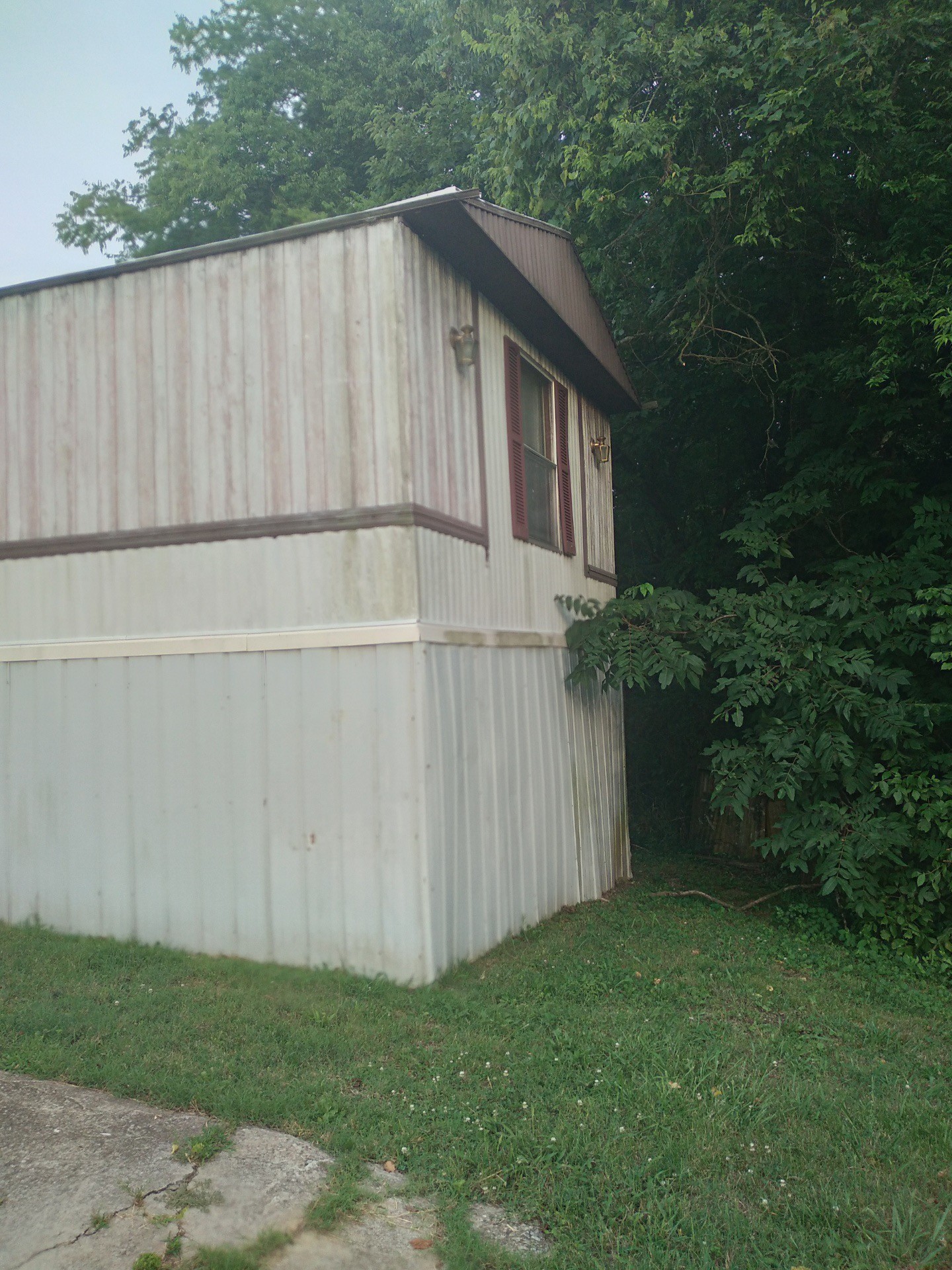 911 Ragsdale Lane Pulaski, TN 38478 - Photo 7 of 66 a white house with a small yard and a wooden fence