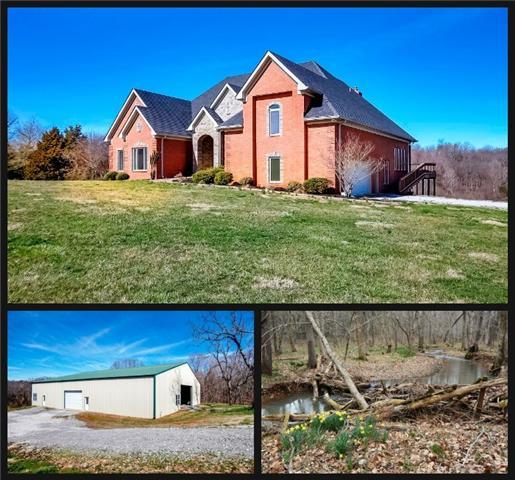 5108 Drake Road Cedar Hill, TN 37032 - Photo 1 of 20 46 acre farm w/custom brick home, 80x100 clear-span building, park-like setting w/2 creeks and wooded area. 45 minute drive to Nashville.