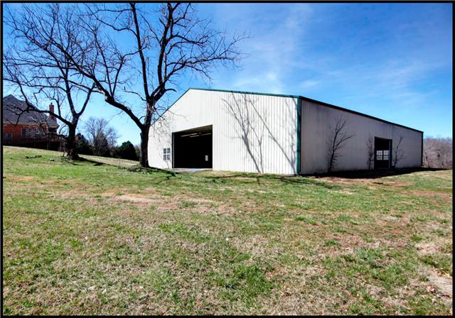5108 Drake Road Cedar Hill, TN 37032 - Photo 16 of 20 80x100 ft single span metal building with reinforced concrete floor features vehicle entry through 3 automatic industrial garage doors. Building has electricity and has wired access to the house's computer network.