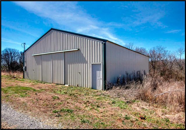 5108 Drake Road Cedar Hill, TN 37032 - Photo 19 of 20 Smaller metal building with dirt floor may be used as a traditional barn for agricultural purposes.