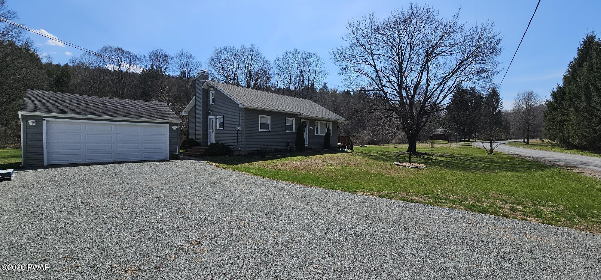 430 Griffith Road Tyler Hill, PA 18469 - Photo 25 of 31 a front view of house with yard and green space