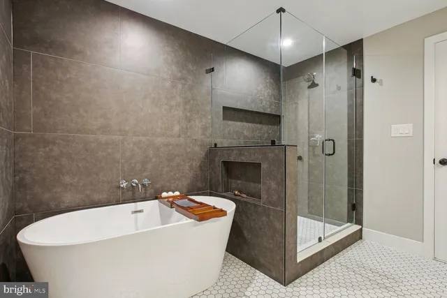 a spacious bathroom with a bathtub and shower