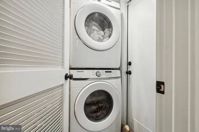 a view of a hallway with washer and dryer