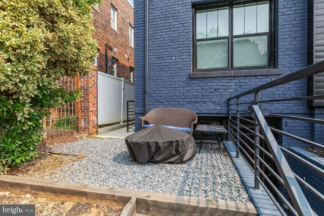a backyard of a house with seating space