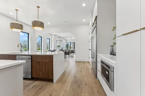 a bathroom with a sink a mirror and vanity