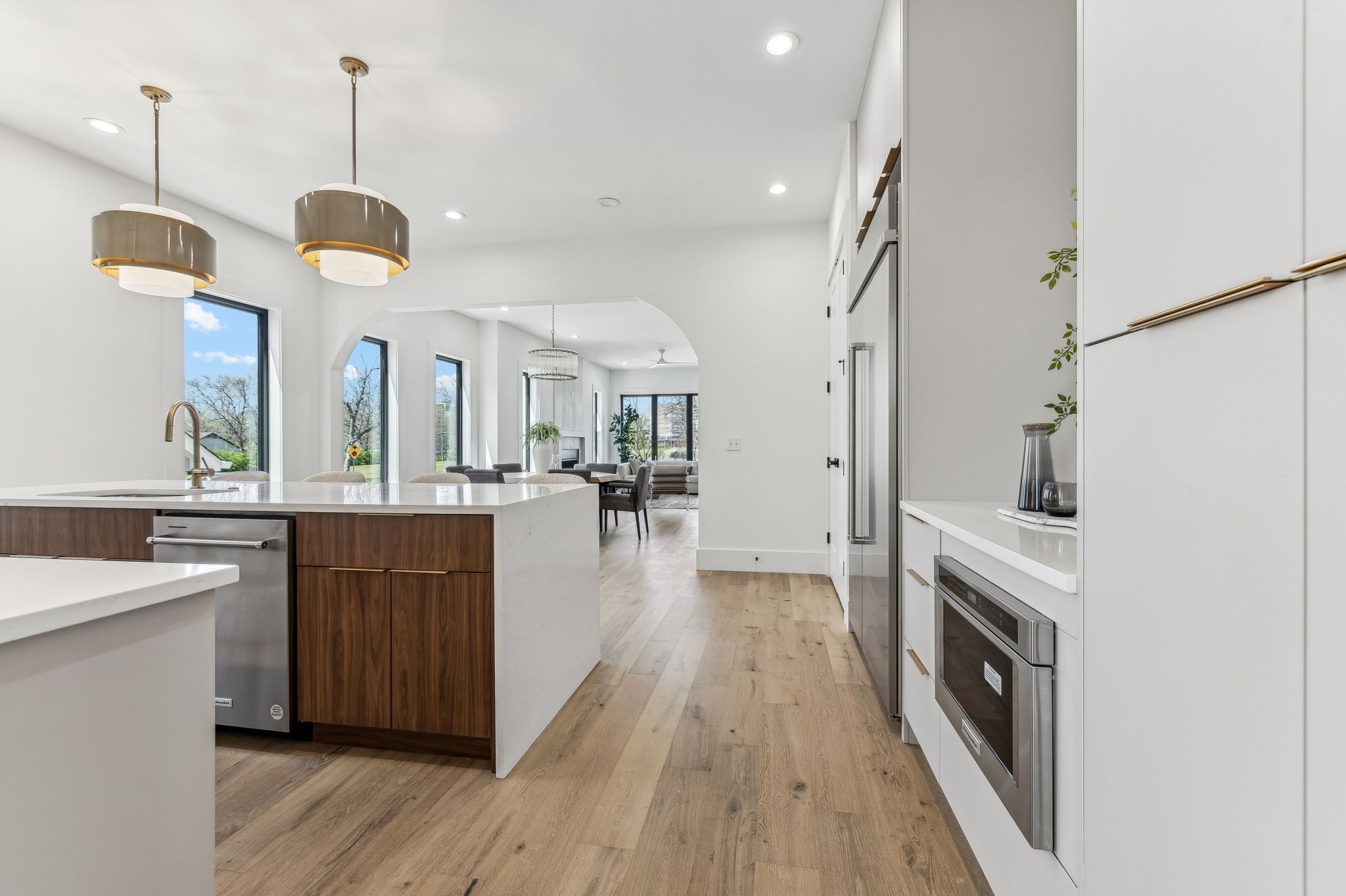 3135 Parthenon Avenue, Unit A Nashville, TN 37203 - Photo 19 of 77 a kitchen with stainless steel appliances granite countertop a stove a sink dishwasher a refrigerator and a wooden floor