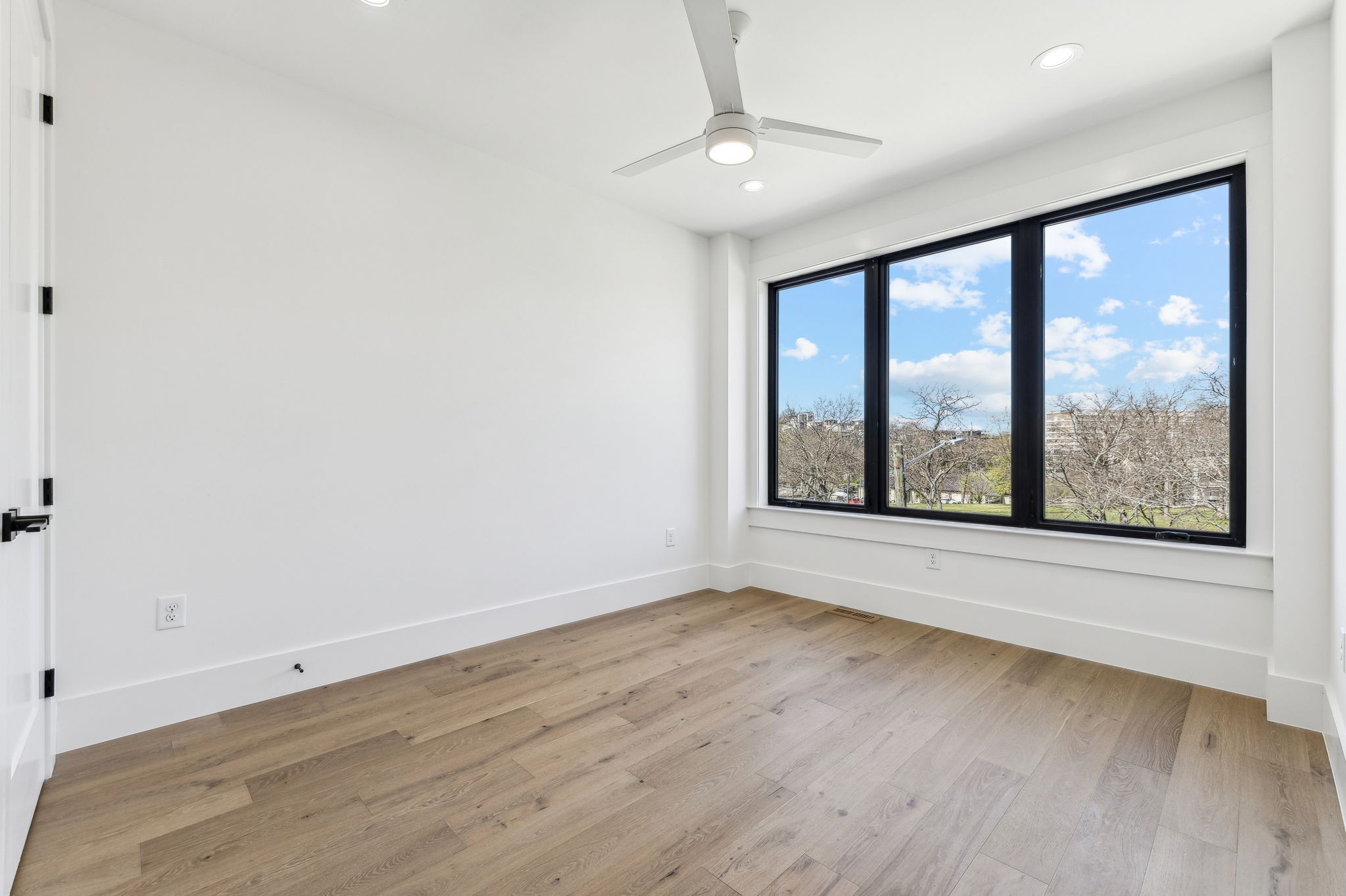 3135 Parthenon Avenue, Unit A Nashville, TN 37203 - Photo 33 of 77 wooden floor in an empty room with a window
